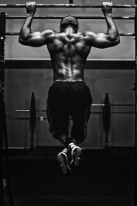 grayscale photo to a man working out
